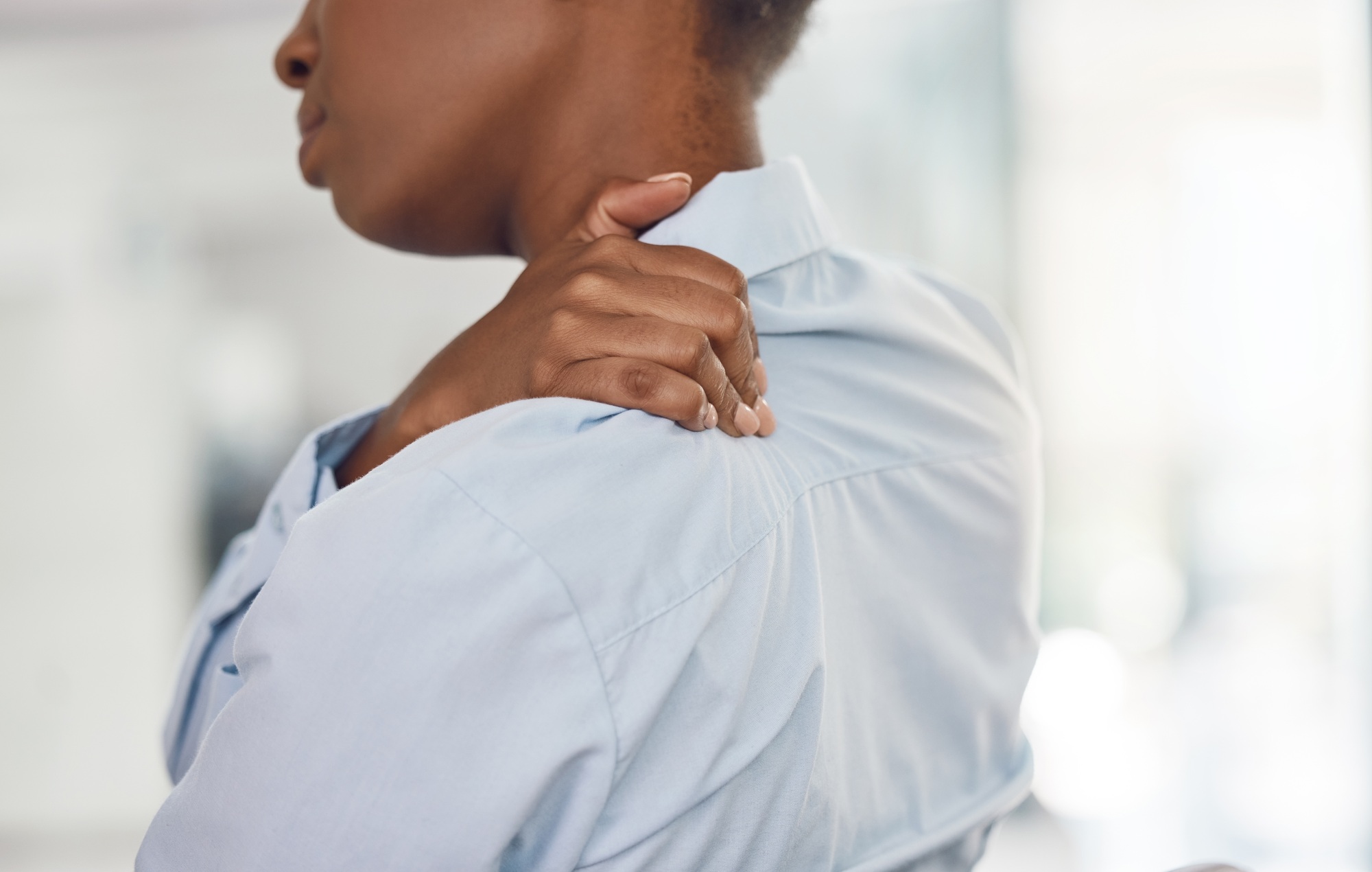 Corporate woman and shoulder pain injury inflammation and backache problem with back view. Business